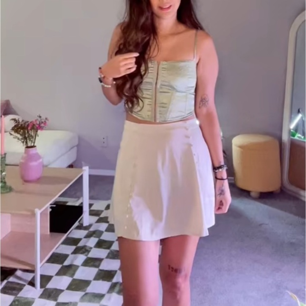 Urban Outfitters cream mini skirt with front button details - size large